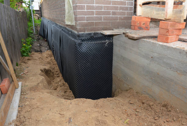 Happy homeowners after waterproofing job in Reeseville